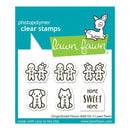 Lawn Fawn photopolymer clear stamps package featuring gingerbread people, a dog, a cat, and a 'Home Sweet Home' sign on a teal and white card.