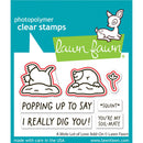 Lawn Fawn photopolymer clear stamps with cartoon moles and text on a blue background