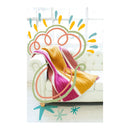 colourful blanket on couch with illustrations of stars and swirls around blanket