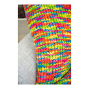 Colorful knitted blanket draped over a surface