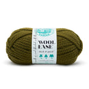 A skein of Lion Brand Wool Ease thick & quick yarn in olive green, wrapped with a white paper label, on a white background.
