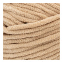 Close-up of beige textured yarn ball