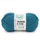 Marine coloured skein of yarn with a label on a white background