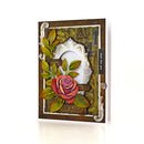 A handmade greeting card featuring a 3D rose with green leaves, an ornate silver frame, and vintage-style elements on a white background.