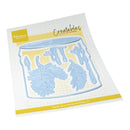 A packaged craft die set from Marianna Design, featuring a light blue leaf and dripping wax motif on a white gridded backing card with yellow accents.