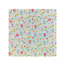 A square of cardstock featuring a colorful, repeating floral pattern on a light blue-gray background, shown flat against a white backdrop.