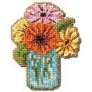 Cross-stitched design of flowers in a jar on a white background