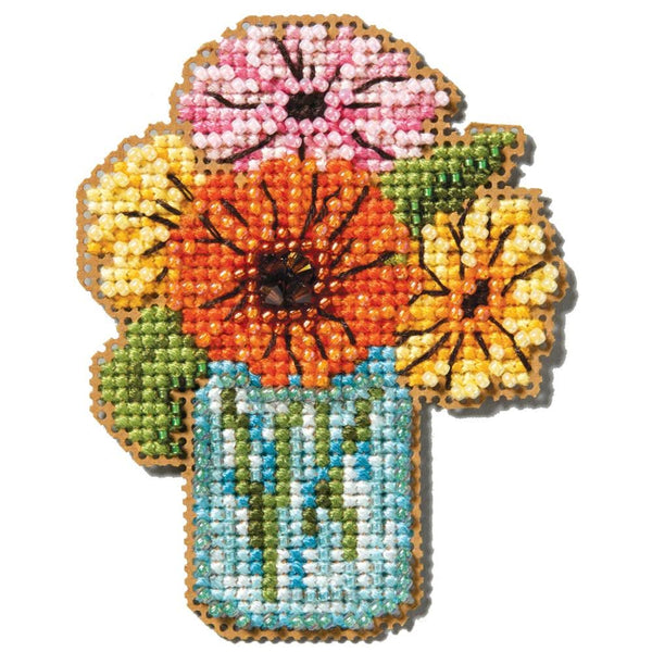 Cross-stitched design of flowers in a jar on a white background