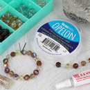 Beaded bracelet with Opelon stretch jewelry fiber on a textured surface