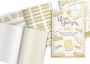 A styled flat-lay of a scrapbook journaling kit featuring cream-colored sheets, gold patterned stickers, and a central card labeled 'Junk Journal edge' with decorative paper and ink illustrations.