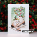 A handmade greeting card featuring a layered paper craft of ice skates with holly leaves and berries, set against a blurred festive background. The card includes the text 'berry merry Christmas' and a 'Penny Black' brand logo in the bottom right corner.