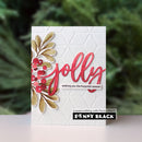 A handmade greeting card with a white embossed background, featuring a gold and red paper floral design on the left, large red 'jolly' script, and a small white banner reading 'wishing you the happiest season.' A Penny Black logo appears at the bottom, with a blurred green outdoor background behind the card.