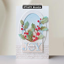 A handmade greeting card featuring a layered oval design with a light blue background, green holly leaves, red berries, and the word 'JOY' in light blue. The card is branded with 'Penny Black' at the top.
