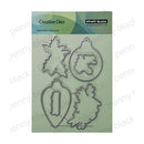 Penny Black Creative Dies steel cutting die set featuring four ornament-shaped metal dies on a light green backing card.