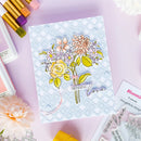 Card with floral design and 'Sending Love' text, surrounded by craft supplies on a light purple background