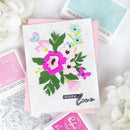 Floral card with 'Sending Love' text on a white background with floral decorations.