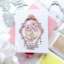 Card with floral design and text 'Friends like you are everything' surrounded by crafting tools.