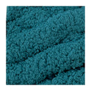A close-up of a chunky, textured plush fabric in a teal blue-green color, framed by white borders on the left and right sides.