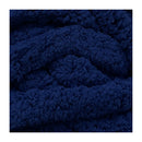 A close-up of a dark navy blue, highly textured plush or sherpa fabric with a chunky, looped surface.