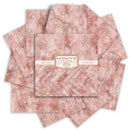 A stack of textured paper sheets in a dusty rose and gold colorway, with a central label reading 'Cousin Bathed in Rose Gold' and 'Hand-painted'.