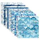 A set of square fabric or paper sheets fanned out on a white background, each featuring blue and white nautical and shell patterns.