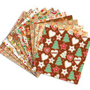A fan of Christmas-themed patterned paper napkins or gift wrap sheets on a white background, featuring designs with gingerbread cookies, candy canes, stars, hearts, and trees in brown, beige, green, red, and white.