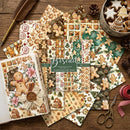 Collection of Christmas-themed scrapbooking paper sheets with gingerbread men and cookies on a wooden surface.