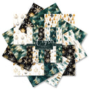 A fan arrangement of layered digital paper designs featuring Christmas patterns in dark teal, white, and metallic gold. The designs include snowflakes, pine trees, ornaments, and stripes, with a central label reading 'Crystal'.