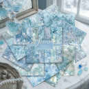Collection of blue and white marbled paper sheets with 'Prism' branding on a decorative surface.
