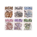 Set of six packages of butterfly-shaped decorative items with colorful designs.