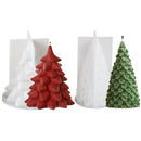 Three Christmas tree-shaped candles displayed on a white background: two white tree-shaped candles in the back and one finished red and green tree-shaped candle in the front.