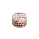 A round roll of 'Crochet Tales' washi tape with a white background, featuring red lace borders, bows, and cherries, shown on a plain white background.