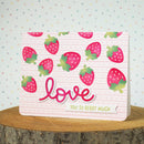 Card with strawberry pattern and 'love you so berry much' text on a polka dot background