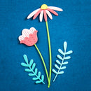 A set of colorful paper cutout flowers and leaves, including a daisy with a yellow center, pink and white petals, and two light blue leaf shapes, arranged on a textured blue background.