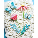 A close-up of a handmade paper craft featuring layered 3D flowers and butterflies on a white textured paper background.