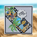 A square handmade greeting card with a pirate-themed cartoon bear design, placed on a sandy beach with a blurred ocean background. The card features a gray patterned background, a black border, a film strip motif, and a speech bubble that reads 'BLIMEY VE KARAĞAZI OLDU!'.
