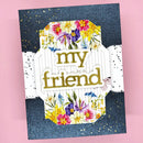 Greeting card with floral design and 'my friend' text on a pink background