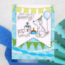 A handmade greeting card featuring a cute dog and cat birthday illustration with the text 'LET'S party!', decorated with green and white bunting, layered scalloped borders, and blue paw-print details on a light blue background.