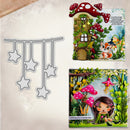 A craft die set featuring hanging star-shaped dies, shown alongside two examples of the colorful 3D papercraft designs that can be created with the die. The designs depict whimsical woodland scenes with a fairy, a small house under red mushrooms, and a girl in a forest.
