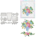 A crafting die set shown on a white background, including metal cutting templates on the left and example stamped floral designs on the right. The floral stamped designs feature pastel pink, blue, yellow, and green flowers in a blue vase, with one card example reading 'sending love'.