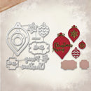 A flat lay of Christmas ornament-themed craft items on a textured beige background, including a metal die-cut cutting template set and red ornament-shaped embellishments with gold and white patterns, one reading 'Christmas Morning'.