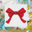 A square white card featuring a simple red ribbon bow illustration, placed on a soft floral background with white, blue, and yellow flowers.