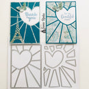 Two handmade paper cards with teal and white designs, shown above a white sheet of matching metal die-cut stencils. The top cards feature a heart, sunburst lines, and decorative butterflies; the bottom sheet shows the corresponding stencil shapes.