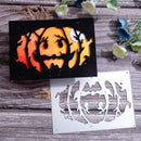 Halloween-themed cutout design on a wooden surface with flowers.