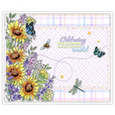 A square greeting card or art print featuring a pastel plaid border, sunflowers, purple flowers, butterflies, a dragonfly, and the phrase 'Celebrating the amazing place you've reached' on a white background.