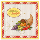A square autumn-themed greeting card or art print with a cream center panel, red-and-white plaid border, and a cornucopia overflowing with pumpkins, grapes, apples, and wheat. The text reads, 'Wishing you homemade joy & heartfelt blessings.