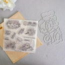 Clear stamp sheet and matching metal die set for autumn harvest-themed stamp designs, displayed on a neutral gray background with a kraft paper envelope and a white flower as props.