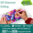 DIY diamond painting kit with a colorful floral and butterfly design on a clear plastic canvas, shown with hands holding a pink needle tool. A green tray of small rhinestones is visible in the top right, with text overlays describing the product and a long service life for a dual-year calendar design.