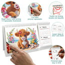 A desk calendar featuring a colorful beaded bull illustration on the front cover, shown with a hand flipping the page. The image includes four circular callout graphics highlighting product features: bright colors and clear printing, freestyle page flipping, double coil binding, and thick paper for writing.