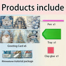 Product listing graphic showing included items for a Christmas-themed diamond painting or greeting card set: six sample greeting cards with winter illustrations, a pink pen, a green tray, and a pink clay glue stick, labeled 'Products include.'.